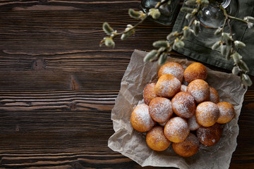 Rosy cheese balls on a dark wooden background. Top view.