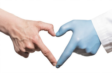 The hands of doctor and patient form a heart on white isolated background.