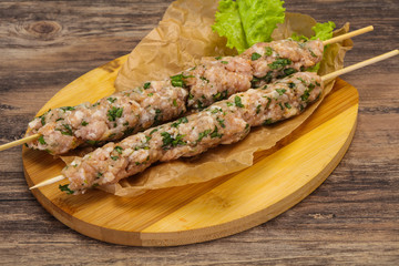 Raw minced pork skewer kebab for grill