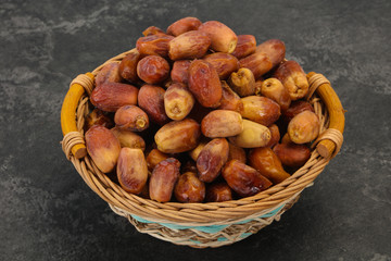 Sweet tasty dry dates in the basket