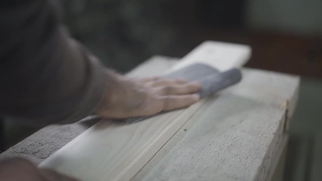Processing and cleaning young wood with sandpaper