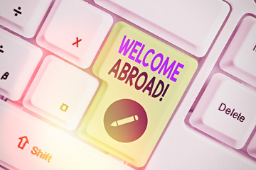 Writing note showing Welcome Abroad. Business concept for something that you say when someone gets...