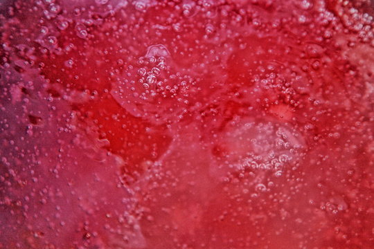 Red boiling jelly bubbles surface, texture for background