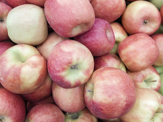 Group of red apples with their leaves