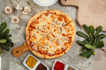 mushroom pizza with mushrooms and spices on the table