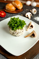 mushroom salad seasoned with mayonnaise on a white plate
