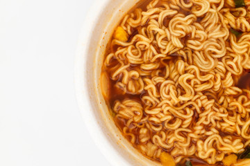 Instant cup ramen on white background