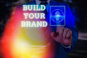 Conceptual hand writing showing Build Your Brand. Concept meaning enhancing brand equity using...