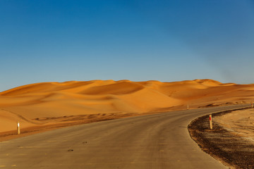 Fototapeta na wymiar Road through the desert to the Moreeb dune in Liwa Oasis, Emirate of Abu Dhabi, UAE