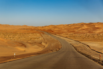 Road through the desert to the Moreeb dune in Liwa Oasis, Emirate of Abu Dhabi, UAE