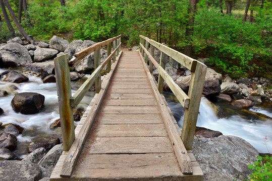 A footbridge crosses the creek at Woodbine Campground in the Custer Gallatin National Forest in Montana, USA
