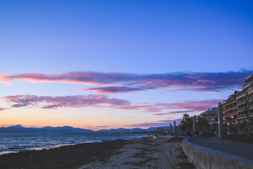 El Arenal promenade at night. Scenic colorful sky at sunset. Mallorca, Spain.