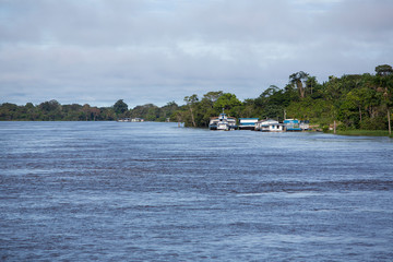 Small harbor and public boats on the Amazon River in Brazil