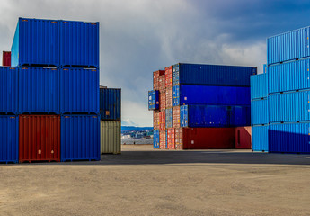 Harbor yard with some stacked containers 