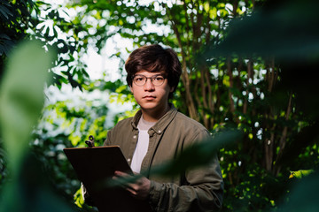 Nature protection concept. Male scientist looking at the camera