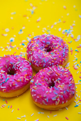 pink donuts with sugar sprinkles 