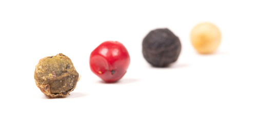 Peper background, white, green, black and red, selective focus on the green peper