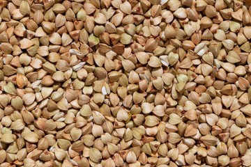 Solid background of raw buckwheat