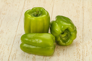Three green bell juicy peppers