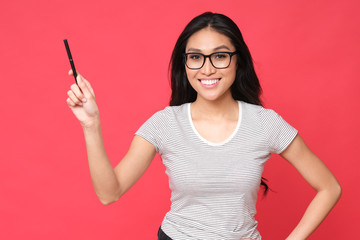 Beautiful and smart asian student smiling to the camera. 