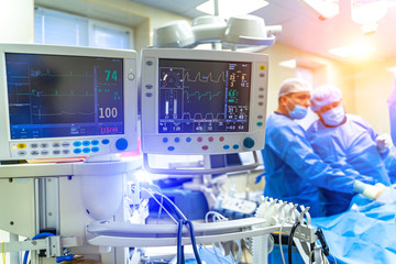 Artificial lung ventilation monitor in the intensive care unit. Nurse with medical equipment. Ventilation of the lungs with oxygen. COVID-19 and coronavirus identification. Pandemic. - obrazy, fototapety, plakaty