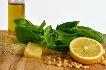 Ingredients for pesto sauce on wooden background