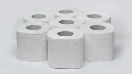 Rolls of toilet paper on a white background. Outbreak of the coronavirus concept COVID-19. Coronavirus - 2019-nKoV. Stay at home while in quarantine.