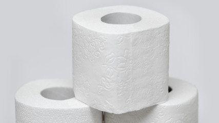 Rolls of toilet paper on a white background. Outbreak of the coronavirus concept COVID-19. Coronavirus - 2019-nKoV. Stay at home while in quarantine.