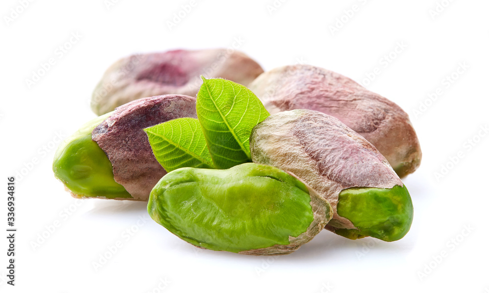 Canvas Prints Pistachio kernel with leaves on white background