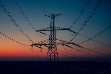 Fototapeta premium high voltage post,High voltage tower sky sunsetbackground