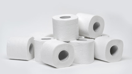 Rolls of toilet paper on a white background. Outbreak of the coronavirus concept COVID-19. Coronavirus - 2019-nKoV. Stay at home while in quarantine.