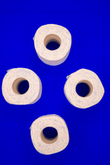 rolls of toilet paper on a blue background