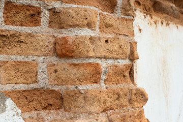 Background of old vintage brick wall with concrete,Ancient walls and walls are damaged.