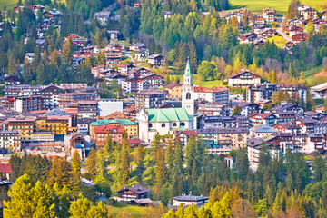 Town of Cortina d' Ampezzo in green landscape of Dolomites Alps