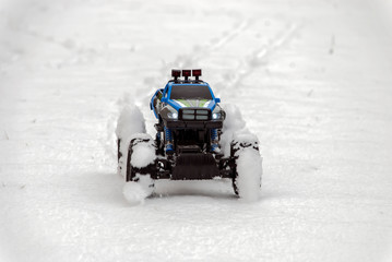 model of roadster driving on snow