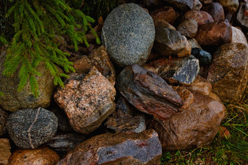 Fototapeta na wymiar Granite stones, rocks set us background. Big granite stones boulders of various forms. Stone for the background.