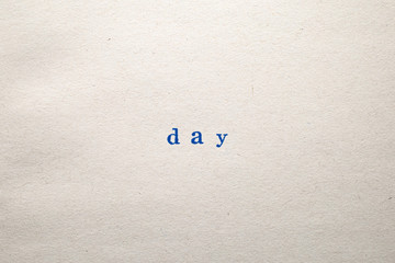 a DAY word stamped on a piece of paper.