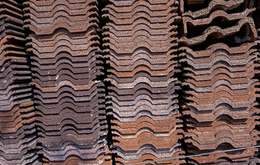 .large quantity of stacked roof tiles