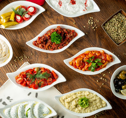 bowls with different types of cold snacks