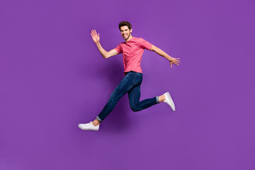 Fototapeta na wymiar Full body photo of cheerful enthusiastic man jump see his girlfriend wave hand say hi wear good look youth style outfit shoes isolated over shine color background