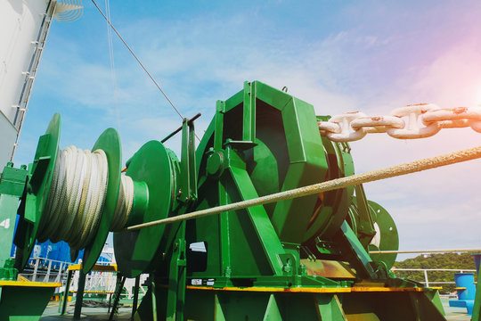 Low angle image Mooring winch, Mooring windlass rope anchor and anchor chain in drum at Deck ship forward in shipyard.