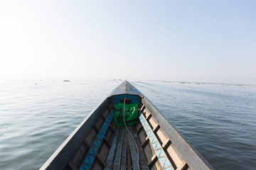 Fototapeta na wymiar A wooden traditional boat in inle lake