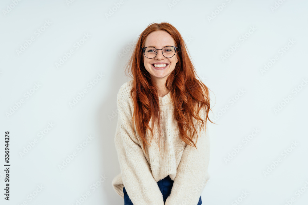 Wall mural smiling friendly young woman wearing spectacles - Wall murals