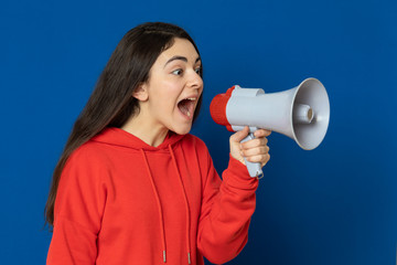 Brunette young girl wearing red jersey