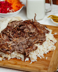 close up of lamb doner kebab with rice and flatbread