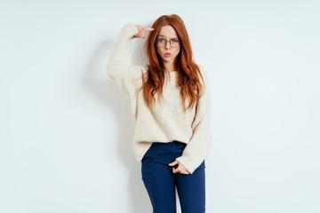 Forgetful charismatic young woman pulling a face