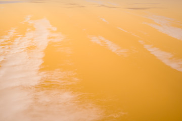 white clouds with orange sky, infrared filter