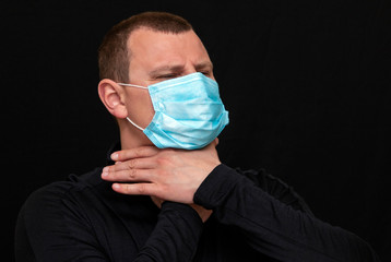 a man puts on a medical mask on his face, instructions on how to wear a mask