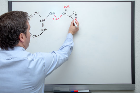 Adult Man Investigating Chemical Formula Of Covid-19