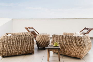 	
Modern home interior design with armchairs. Elegant rustic accessories with table and coffee cup....